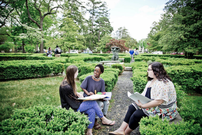 GCU Students sitting in garden