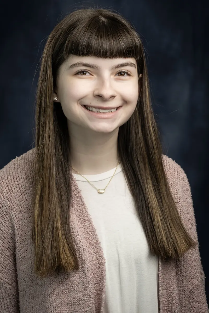 A young girl smiling