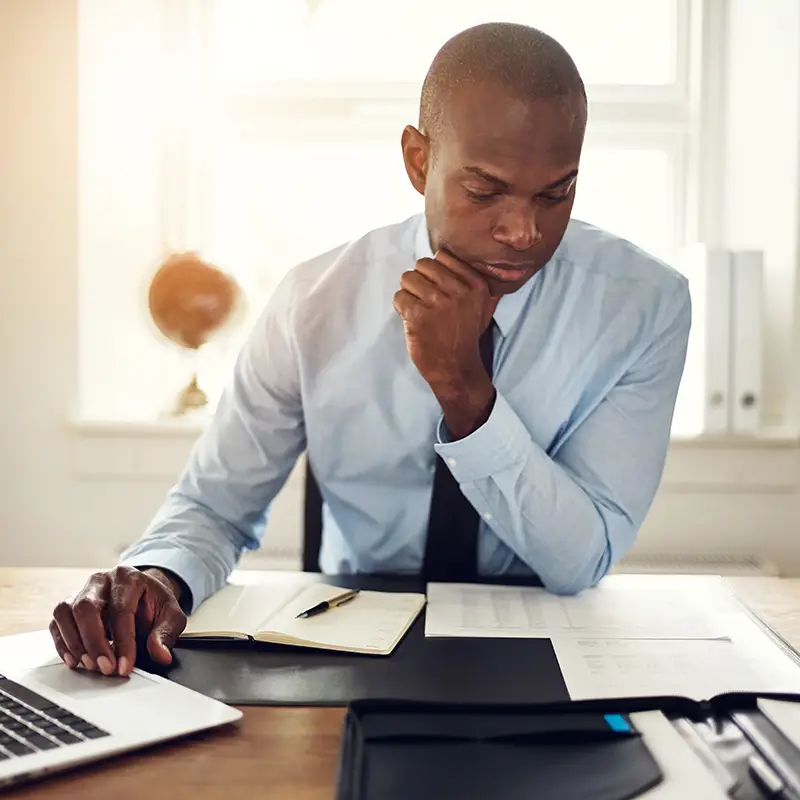 A male accounting professional on a laptop