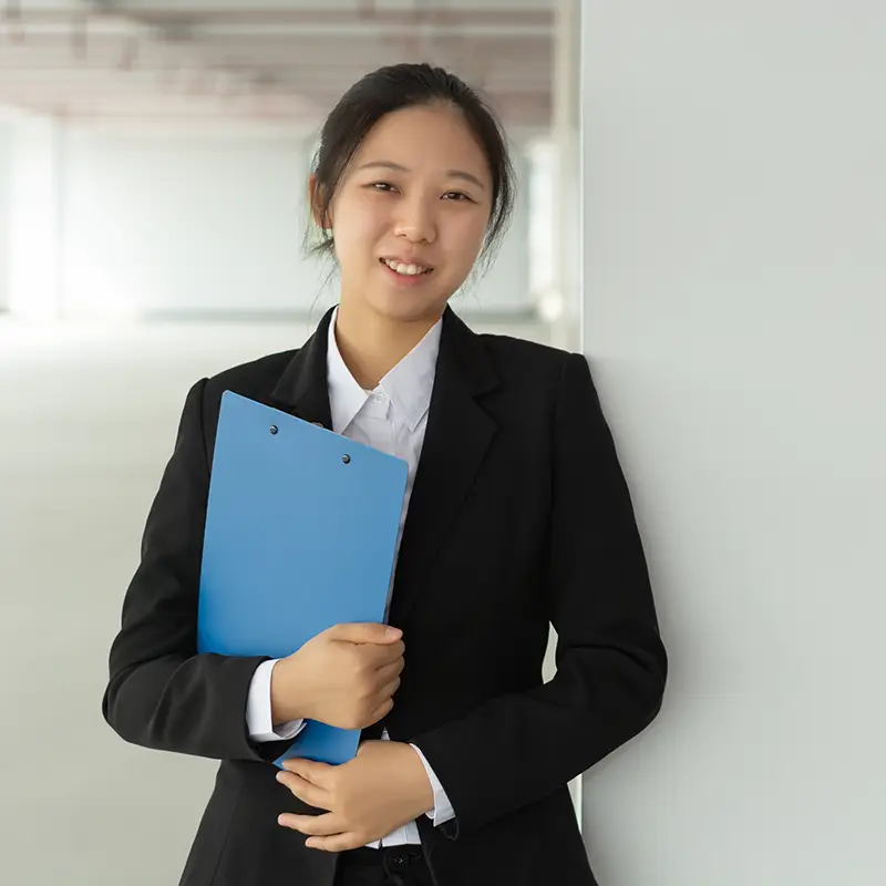 An asian woman holding a folder