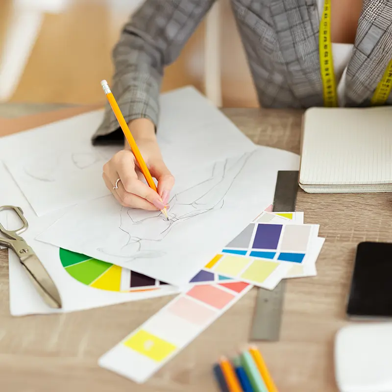 A Bachelor of Arts in Visual Art female student drawing on paper