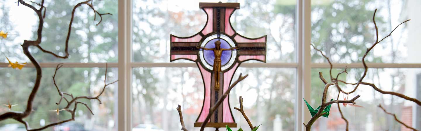 Cross in front of window
