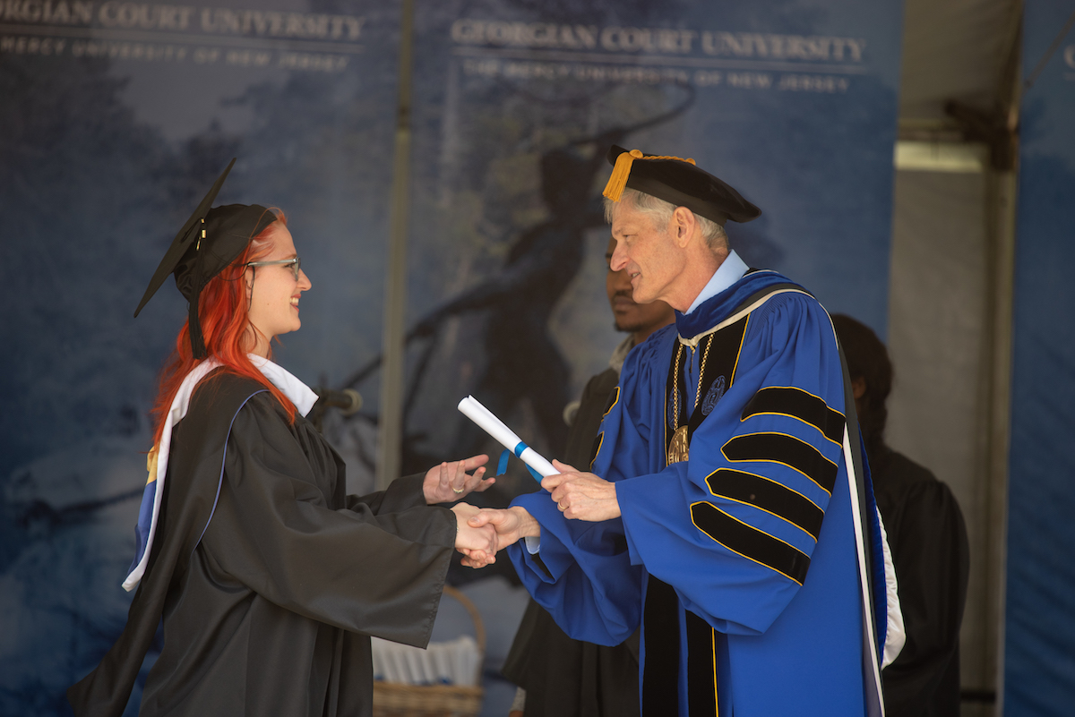 graduate receives diploma