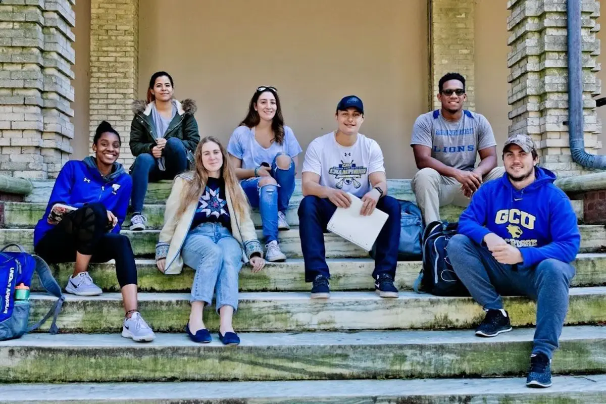 GCU students sitting on steps