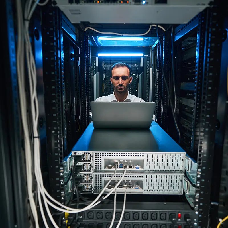 A male computer information systems student working on a database