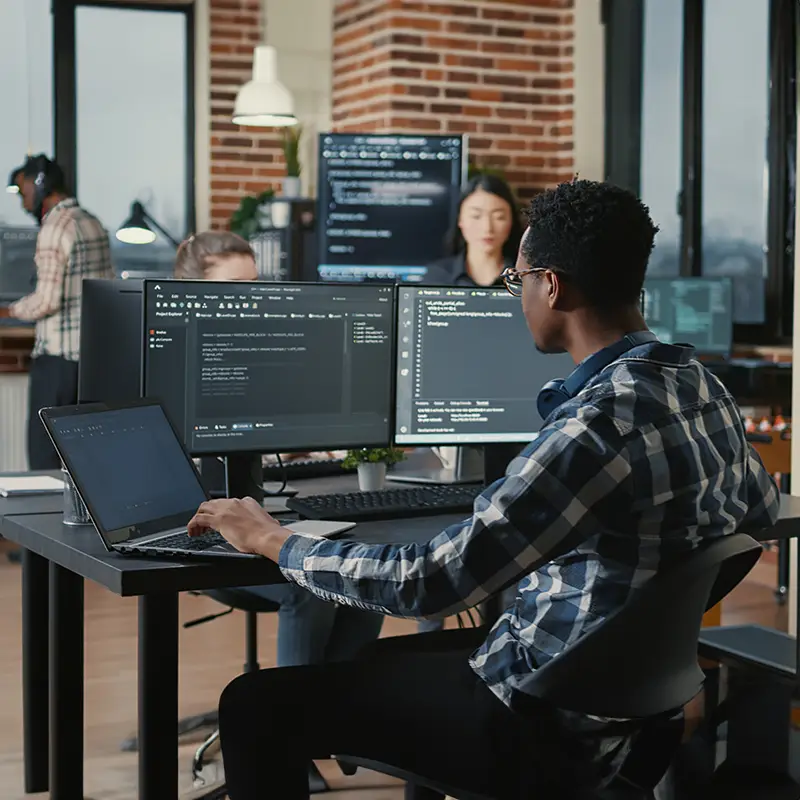 A male computer information systems student sitting at a computer