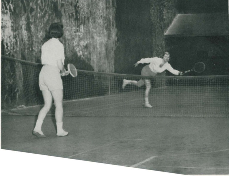 Old-fashioned photo of two women playing tennis at GCU.