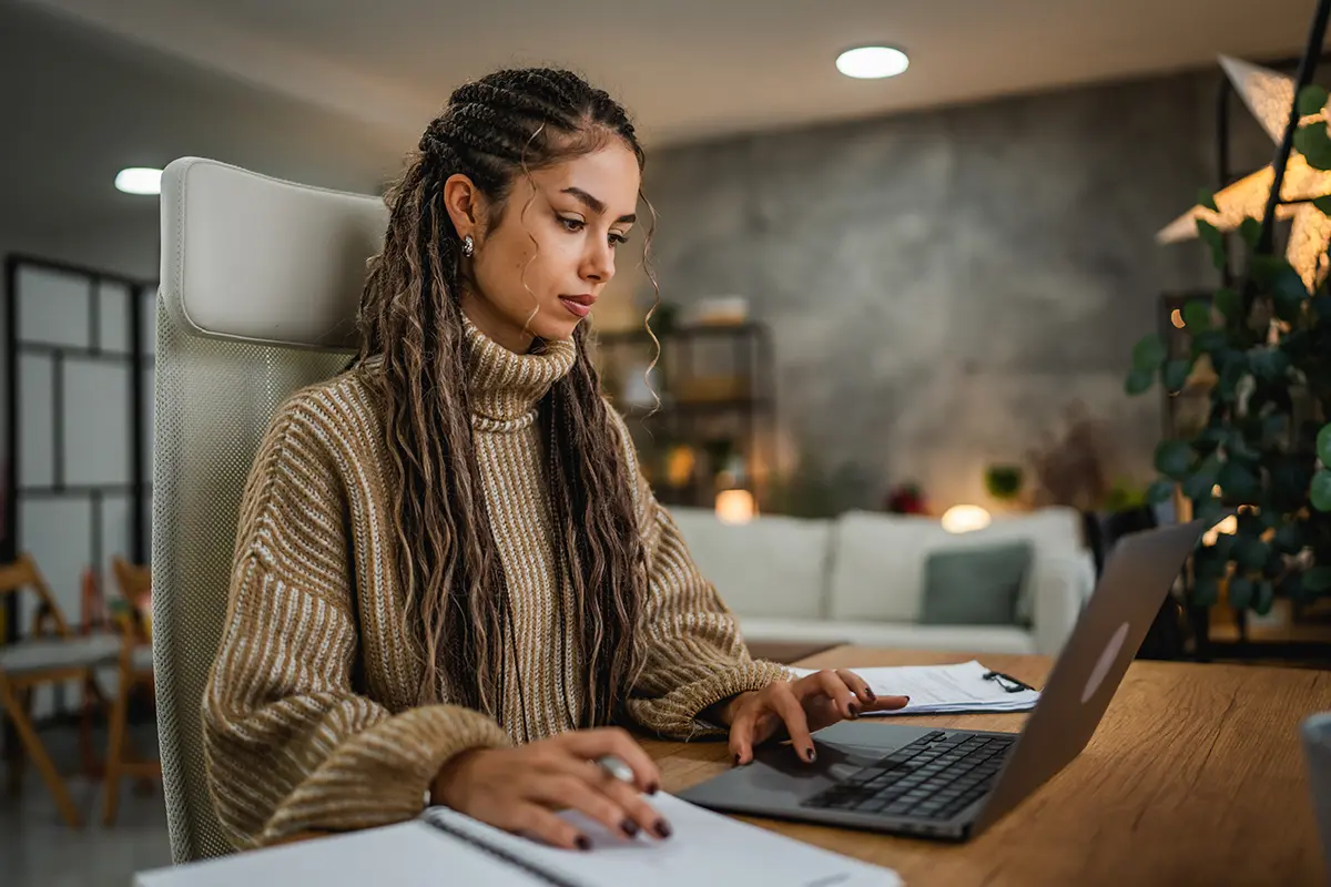 A woman working on a laptop computer