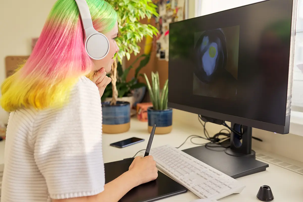 Graphic Design major working on a computer