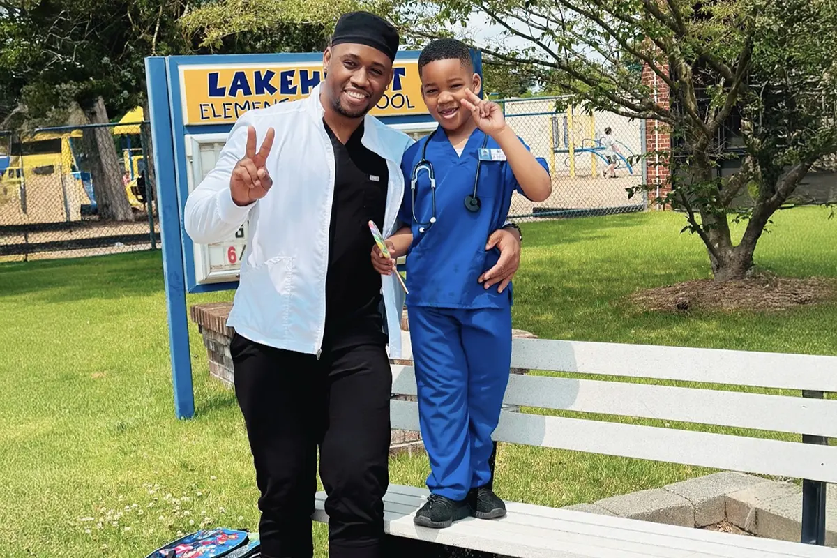 A man and his son standing