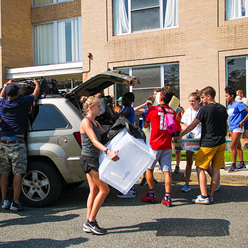 Students moving into a dorm