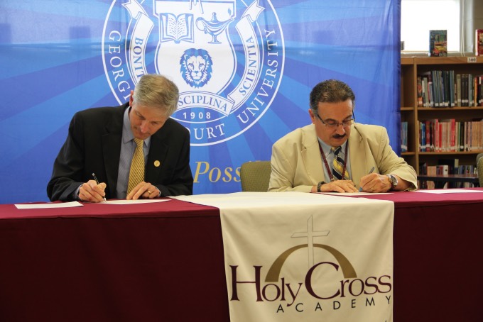 President signing partnership with Holy Cross academy