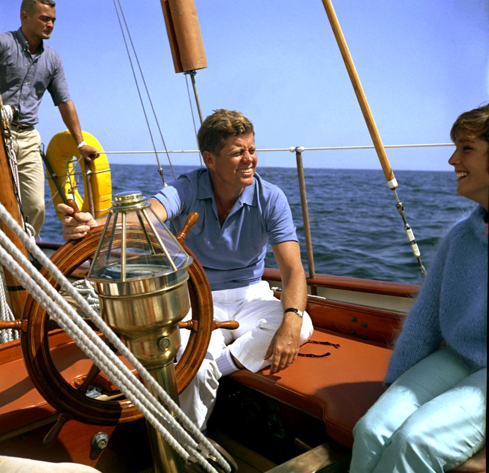 JFK sailing with two other people