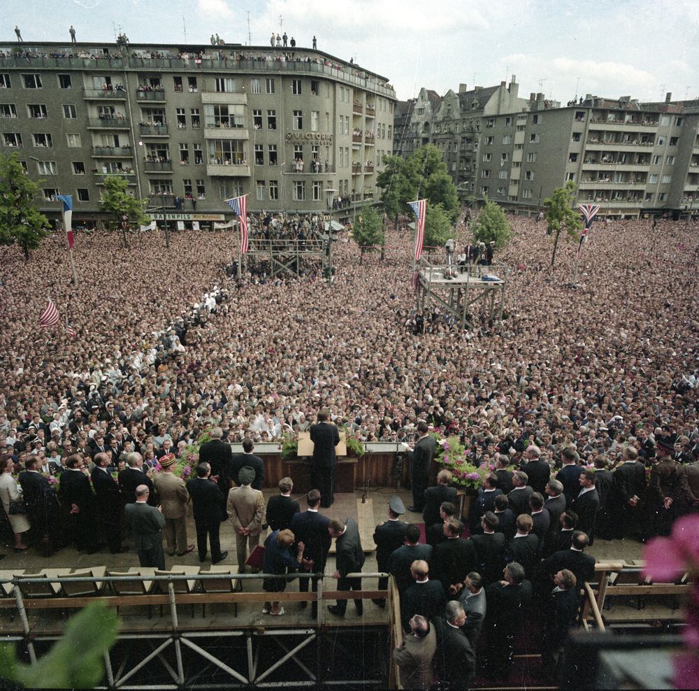 A large group of people gather in Berlin