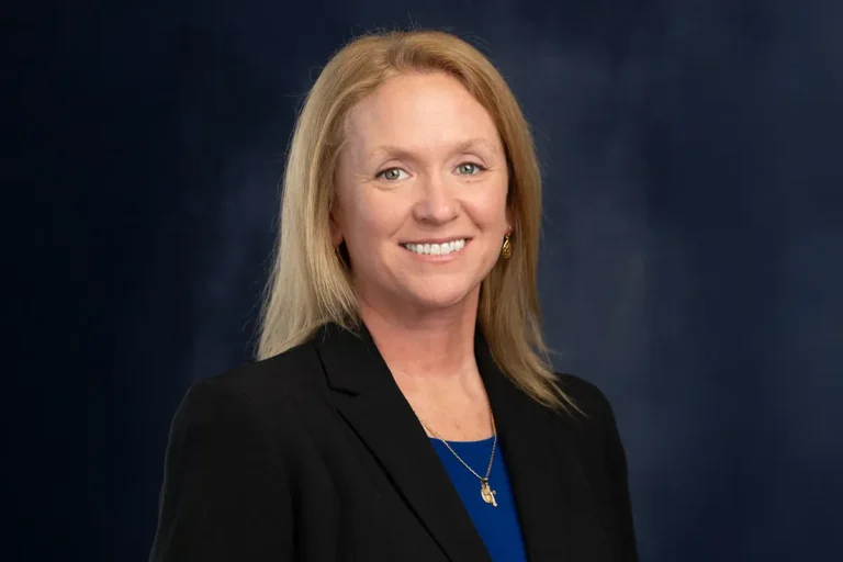 A woman smiling at the camera