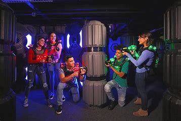 playing laser tag in the dark with neon lights