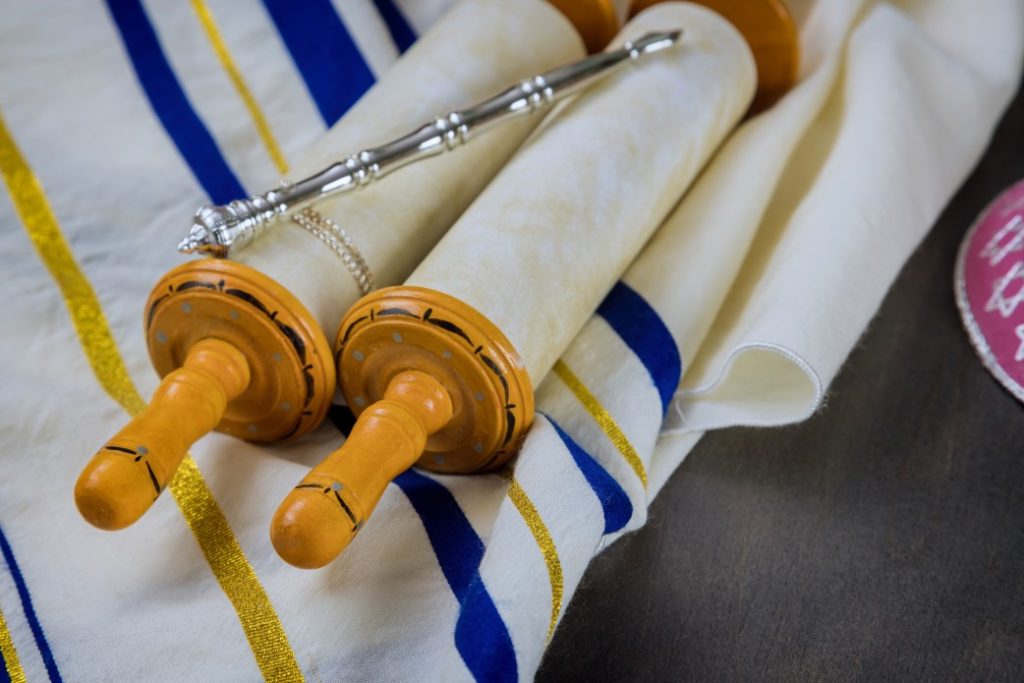 Orthodox Jewish prayer shawl tallit with Torah scroll