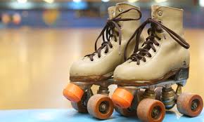 brown rolling skates with orange wheels