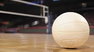 white volleyball sitting on gym floor