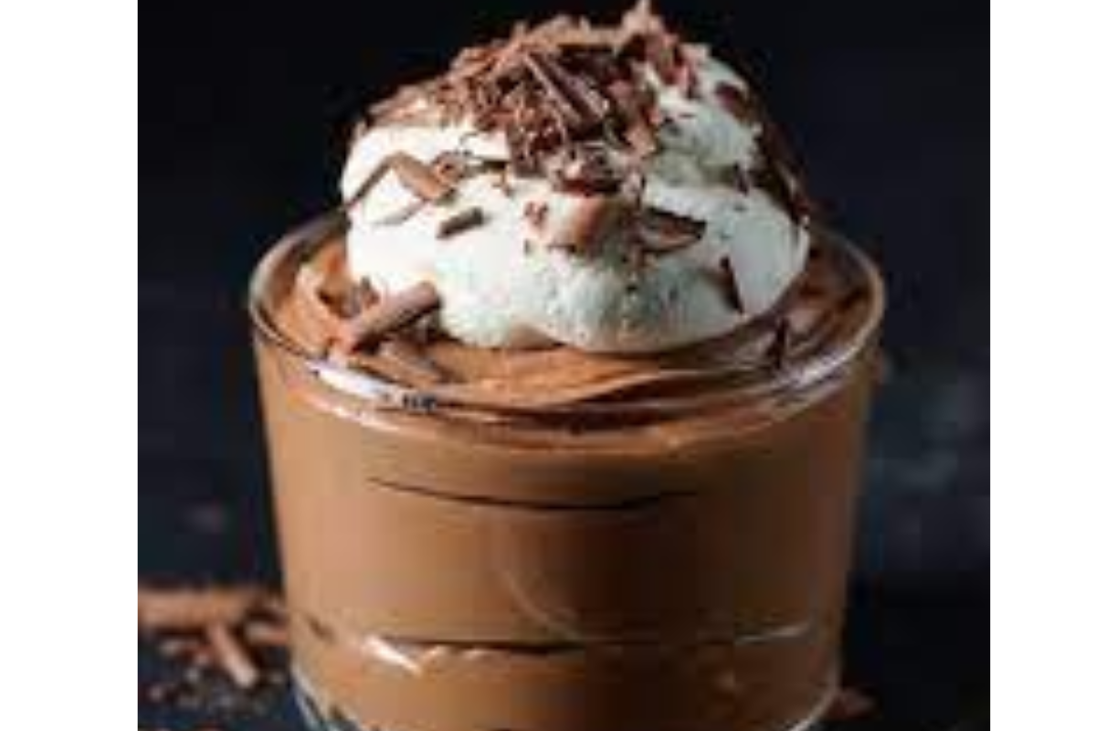 cup of chocolate mousse with whipped cream on top