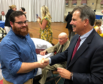 Two men shaking hands.