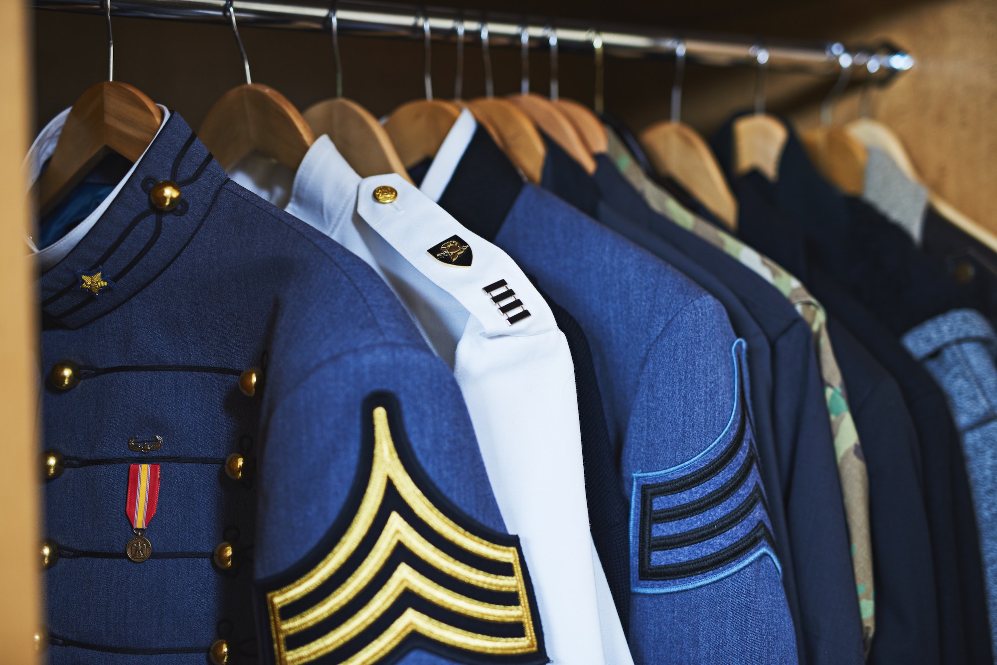 The closet of heroes. Shot of various military jackets hanging in a closet.